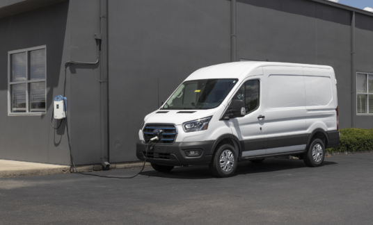 Ford E-Transit Cargo Van at a dealership. The Ford E-Transit has an electric motor providing 266hp. C rijbewijs