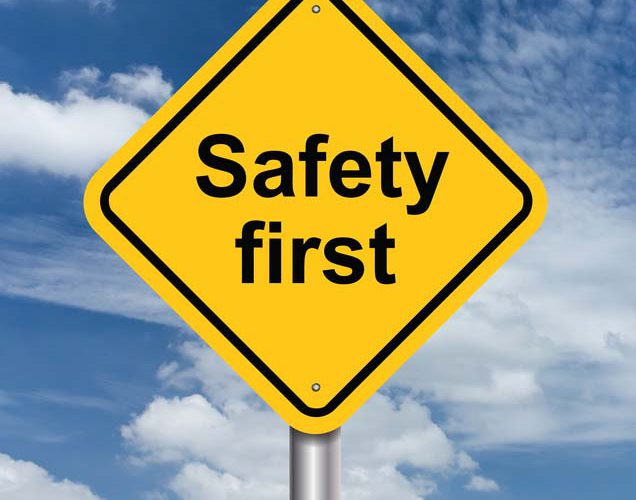 safety first sign banner and clouds blue sky background