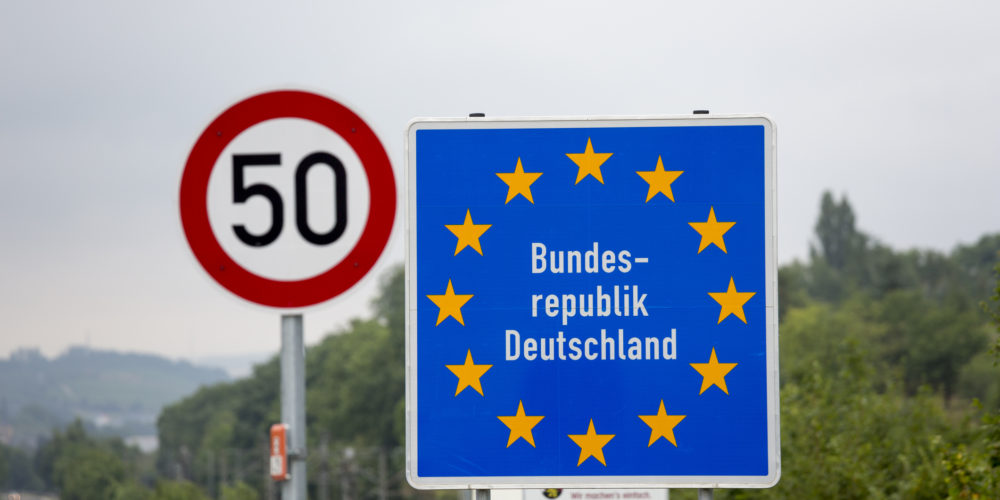 Road signs in Europe, border crossing into Germany