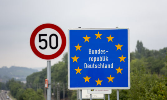 Road signs in Europe, border crossing into Germany