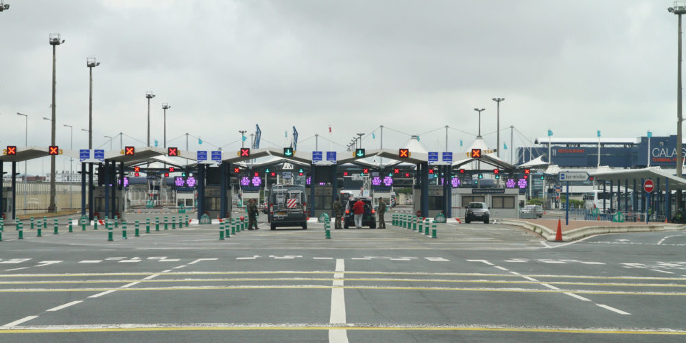 UK border control at Calais France , armed security guards searching vehicles