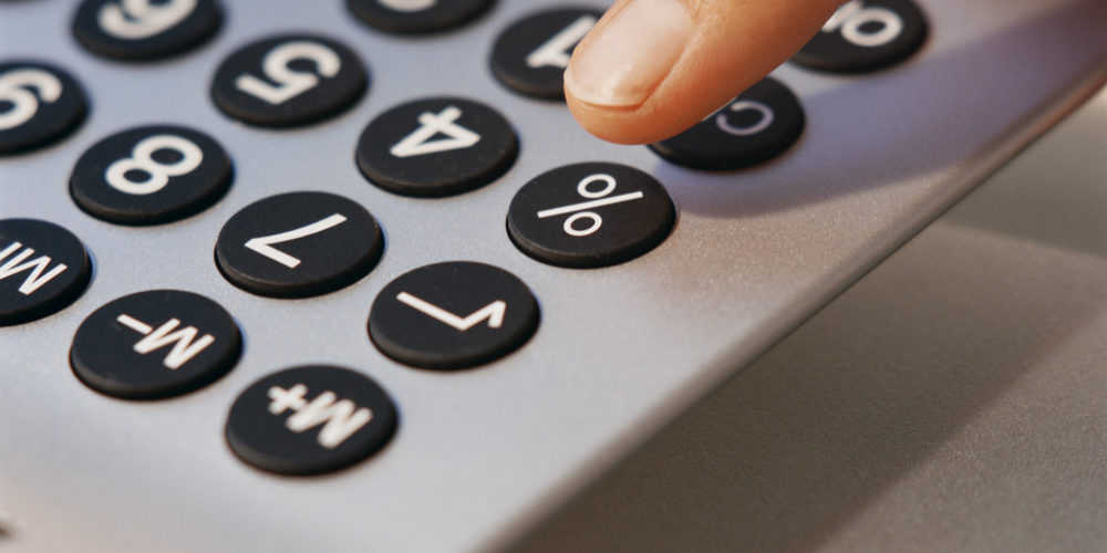 Finger Pressing Button on Calculator – Rekenmachine