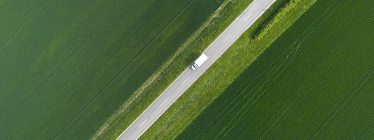 Road through agricultural area – aerial view