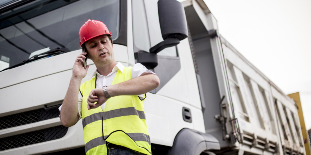 Truck driver talking on mobile phone