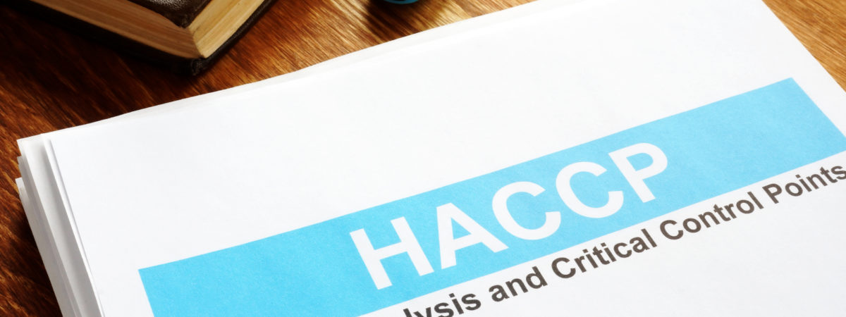 HACCP Hazard Analysis and Critical Control Points report on table.